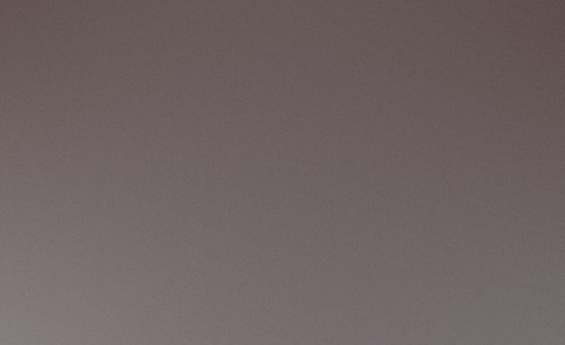 Personal trainer coaching client with battle ropes